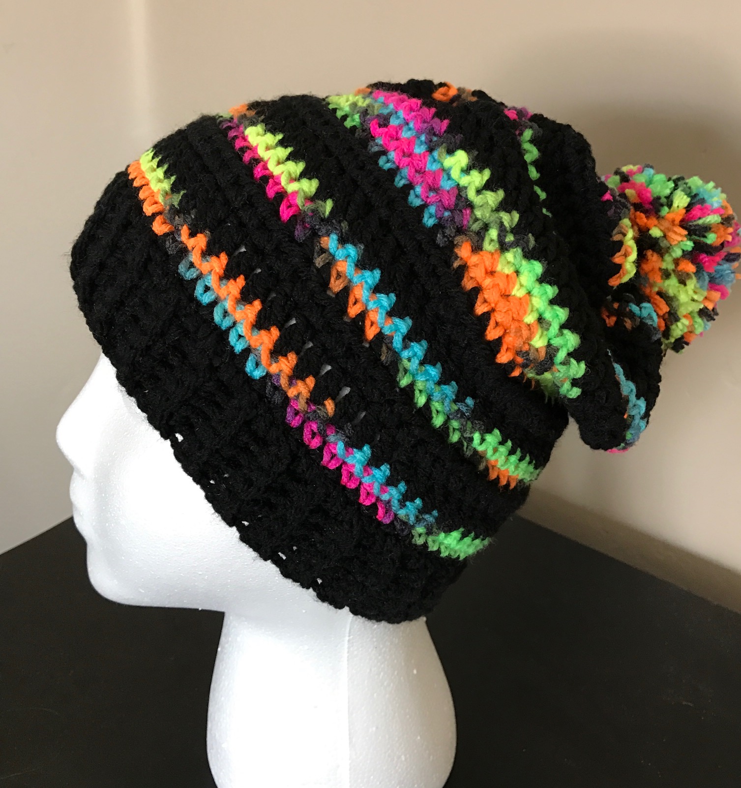 I adore this crochet hat! The bright colors just pop against the black! Great free pattern!